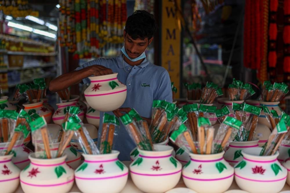 The Tamil community preparing the items to celebrate Ponggal harvest festival this Sunday, including purchasing colourful designed clay pots, milk, sugarcane and turmeric bunches to celebrate the festival during a survey in Brickfields. Photo by Bernama.