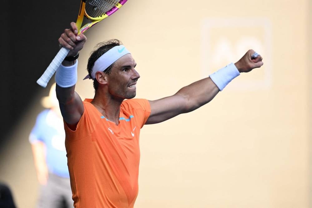 Spain's Rafael Nadal celebrates after winning against Britain's Jack Draper during their men's singles match on day one of the Australian Open tennis tournament in Melbourne on Jan 16, (Photo by WILLIAM WEST / AFP) 