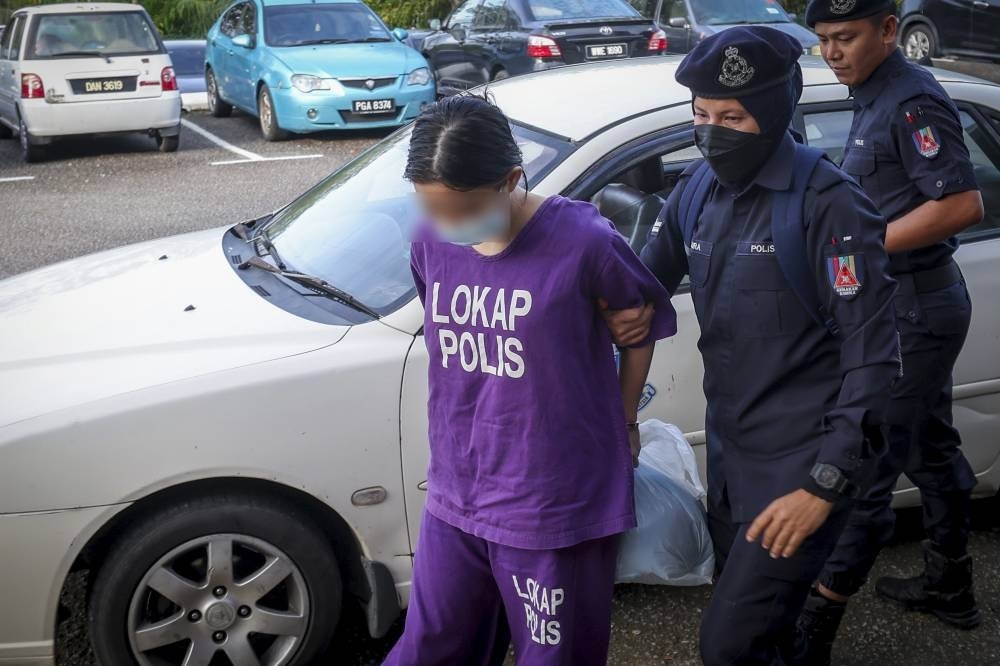 Umishahirah was charged in the Sessions Court here today with murdering her 18-month-old son in Cyberjaya last week. Photo by Bernama.