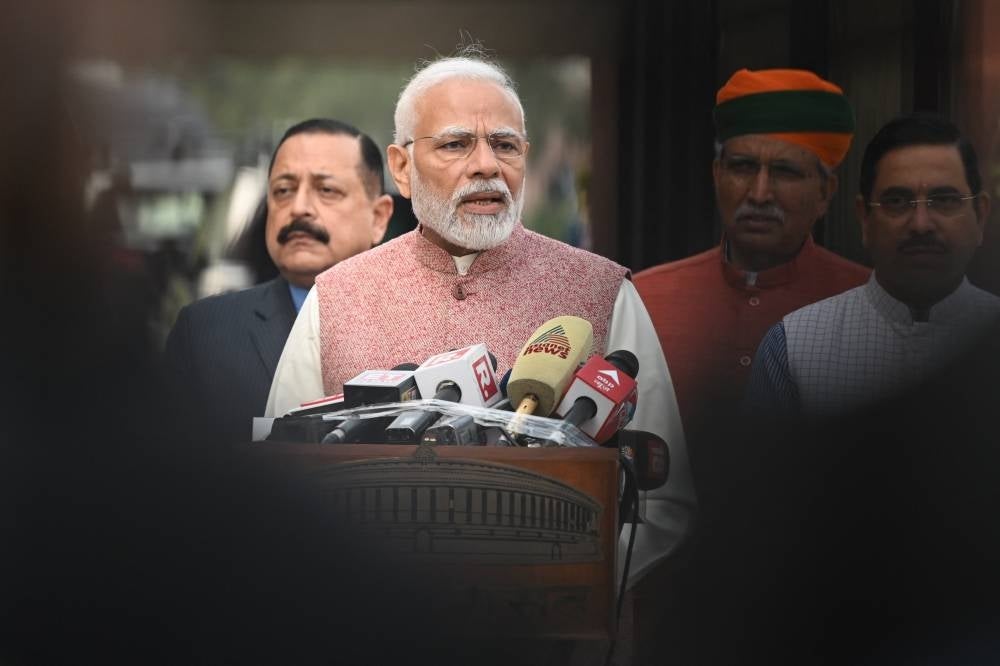 Indian Prime Minister Narendra Modi speaks to the media prior to the start of the opening of the winter session of Parliament in New Delhi on Dec 7, 2022. - (Photo by SAJJAD HUSSAIN / AFP)