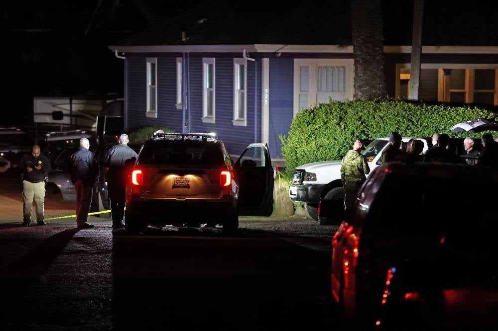 Law enforcement officials investigate a property following a mass shooting on Jan 23, 2023 in Half Moon Bay, California. Seven people were killed at two separate farm locations that were only a few miles apart in Half Moon Bay on Monday afternoon. - AFP