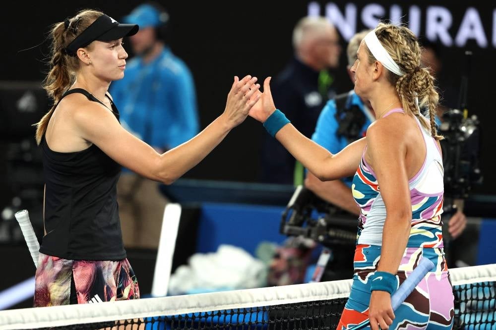 Kazakhstan's Elena Rybakina (L) shakes hands with Belarus' Victoria Azarenka after the women's singles semi-final match on day eleven of the Australian Open tennis tournament in Melbourne on Jan 26. - AFP