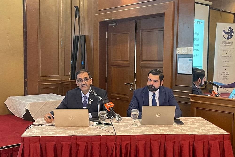Muhammad (left) while presenting the Malaysia's Corruption Perceptions Index (CPI) 2022 results on Tuesday.