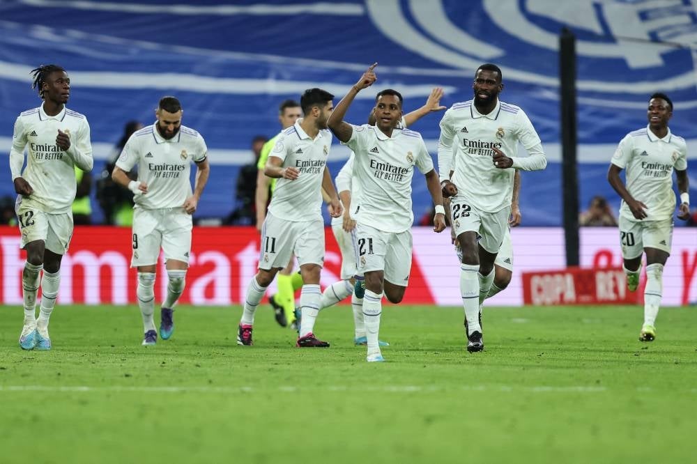 Real Madrid's Brazilian forward Rodrygo (C) celebrates with teammates after scoring his team's first goal during the Copa del Rey (King's Cup), quarter final football match between Real Madrid CF and Club Atletico de Madrid at the Santiago Bernabeu stadium in Madrid on Jan 29. - AFP