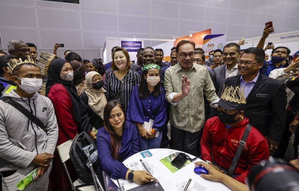 Anwar at the Launching Ceremony of the Housewives Social Security Scheme and the 2023 MYFutureJobs Career Carnival - FILE PIC 