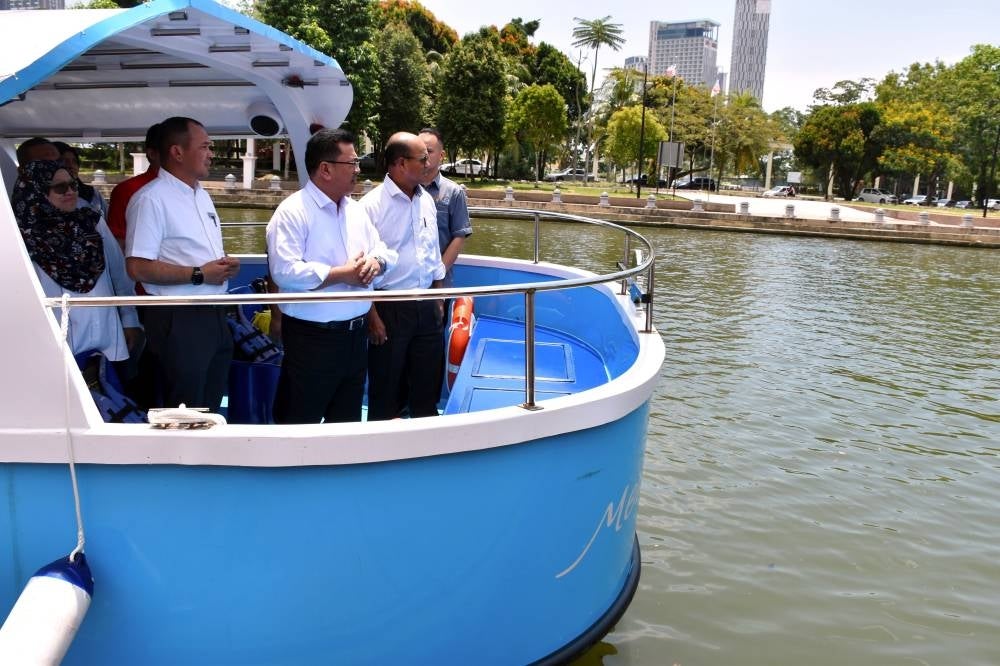 Melaka Chief Minister Datuk Seri Sulaiman Md Ali (third, left) monitoring the state's river cleanup and beautification project - BERNAMA