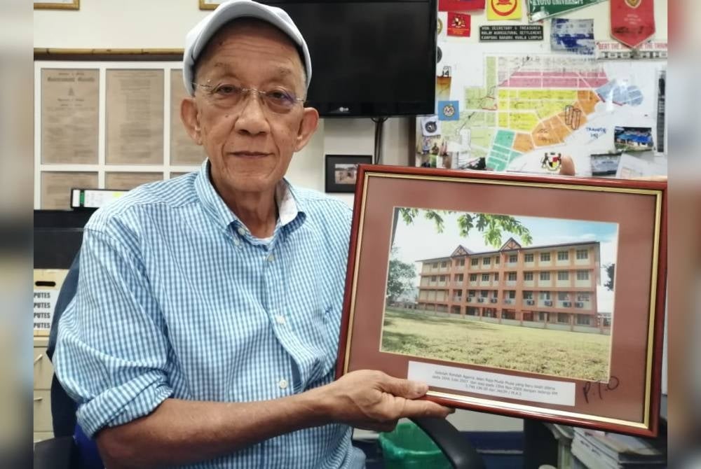 Shamsuri showing the religious primary school built on Mas land to accommodate 600 students in Kampung Baru.