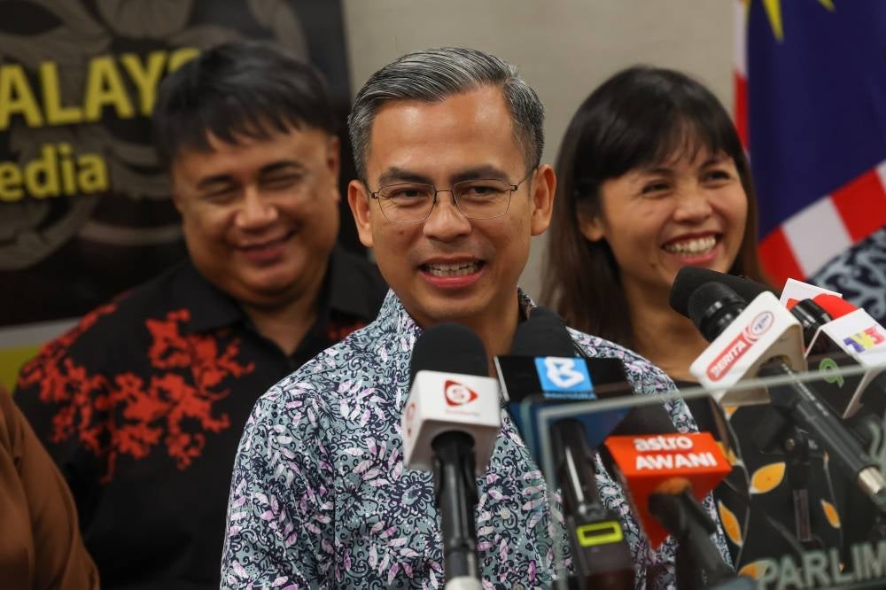 Communications and Digital Minister Fahmi Fadzil speaks during a press conference after visiting the media centre at the Parliament Building today. Also present are Communications and Digital Deputy Minister Teo Nie Ching (right) and Malaysian Broadcasting Department Director General Suhaimi Sulaiman (left). - BERNAMA