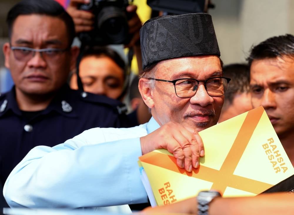 Finance Minister and Prime Minister Datuk Seri Anwar Ibrahim before re-tabling Budget 2023, yesterday. - Photo: BERNAMA