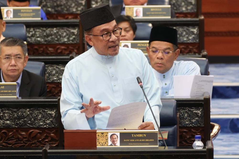 Finance Minister and Prime Minister Datuk Seri Anwar Ibrahim when re-tabling Budget 2023 at the Parliament, yesterday. - BERNAMA