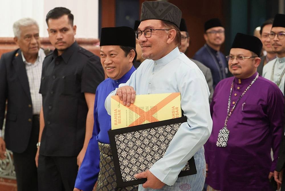 Anwar Ibrahim arrived at the Parliament Building to present the Malaysia Madani Budget 2023 on Friday. Photo: Bernama