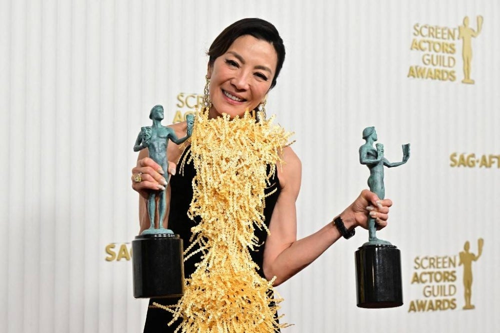 Malaysian actress Michelle Yeoh poses with the award for Outstanding Performance by a Female Actor in a Leading Role and Outstanding Performance by a Cast in a Motion Picture "Everything Everywhere All at Once" during the 29th Screen Actors Guild Awards at the Fairmont Century Plaza in Century City, California, on February 26, 2023. (Photo by Frederic J. Brown / AFP)