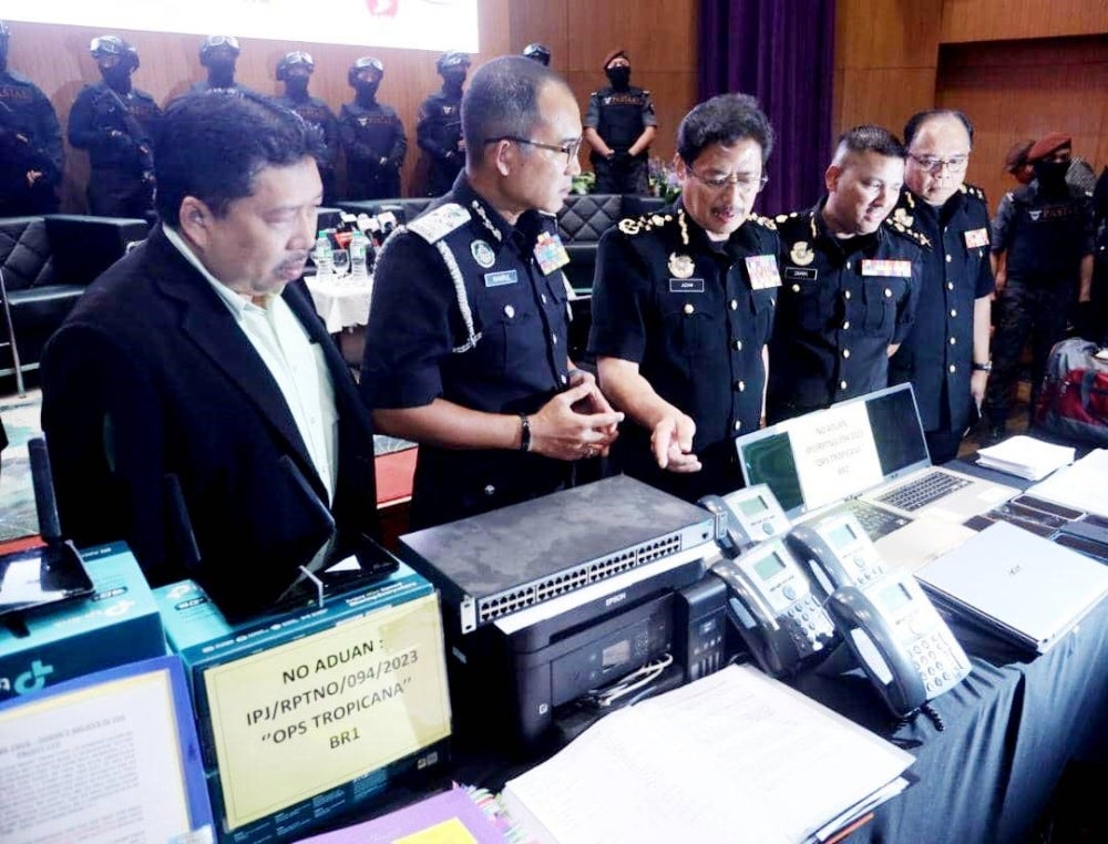 Azam Baki (middle) showing the items confiscated through Op Tropicana in Klang Valley on Feb 21.