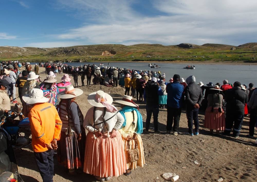 People gather at the site where rescue teams attempted to recover the bodies of five Peruvian soldiers that drowned after jumping into the freezing waters of the river Ilave while fleeing clashes with anti-government protesters throwing rocks at them in Ilave, Peru on March 6. - Five Peruvian soldiers drowned after jumping into a freezing river while fleeing anti-government protesters in the country's south, the defense ministry said Monday. One other who tried to escape via the same route after clashes with demonstrators Sunday was still missing, and a search was under way. Soldiers said they came under attack from people armed with slingshots and sticks at a demonstration against the government of President Dina Boluarte in the city of Ilave in the Puno region. - AFP