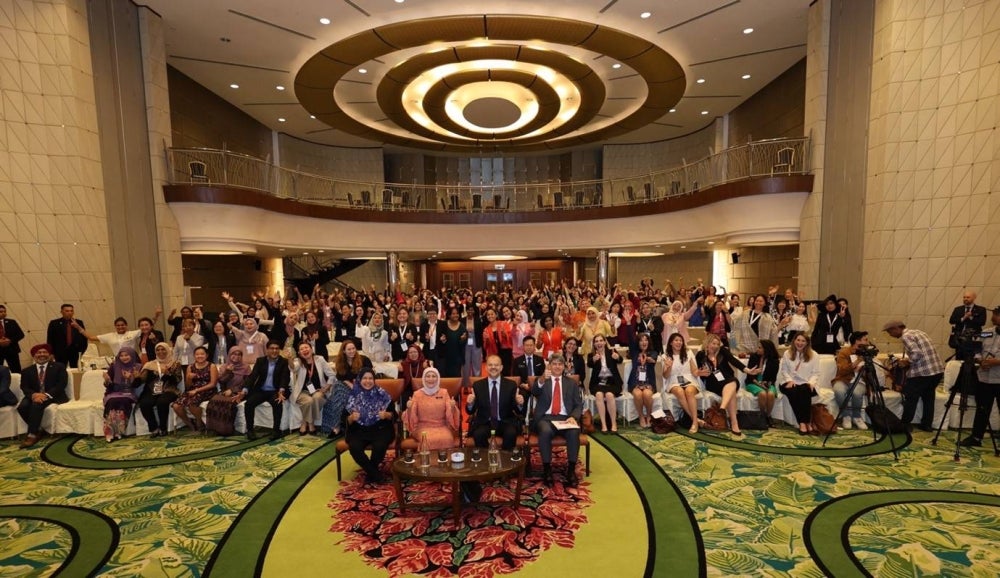 Participants celebrate the launch of the AWE Regional Summit with Participants celebrate the launch of the AWE Regional Summit with Women, Family and Community Development Ministry Dato Sri Nancy Shukri.