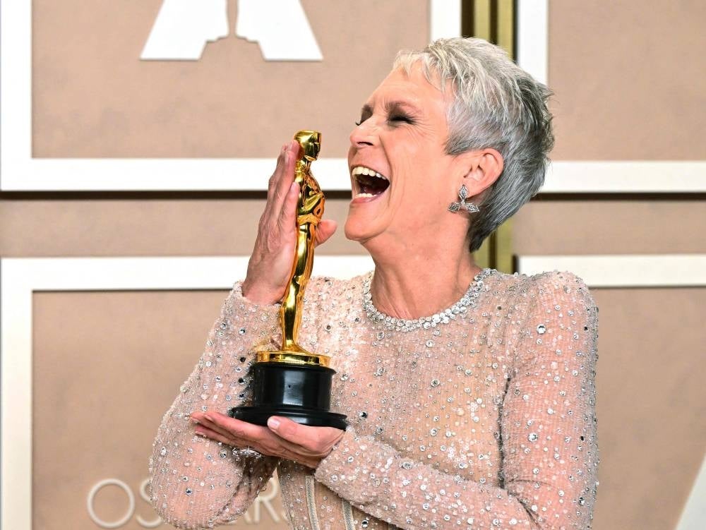 US actress and author Jamie Lee Curtis poses with the Oscar for Best Actress in a Supporting Role for "Everything Everywhere All at Once" in the press room during the 95th Annual Academy Awards at the Dolby Theatre in Hollywood - AFP 