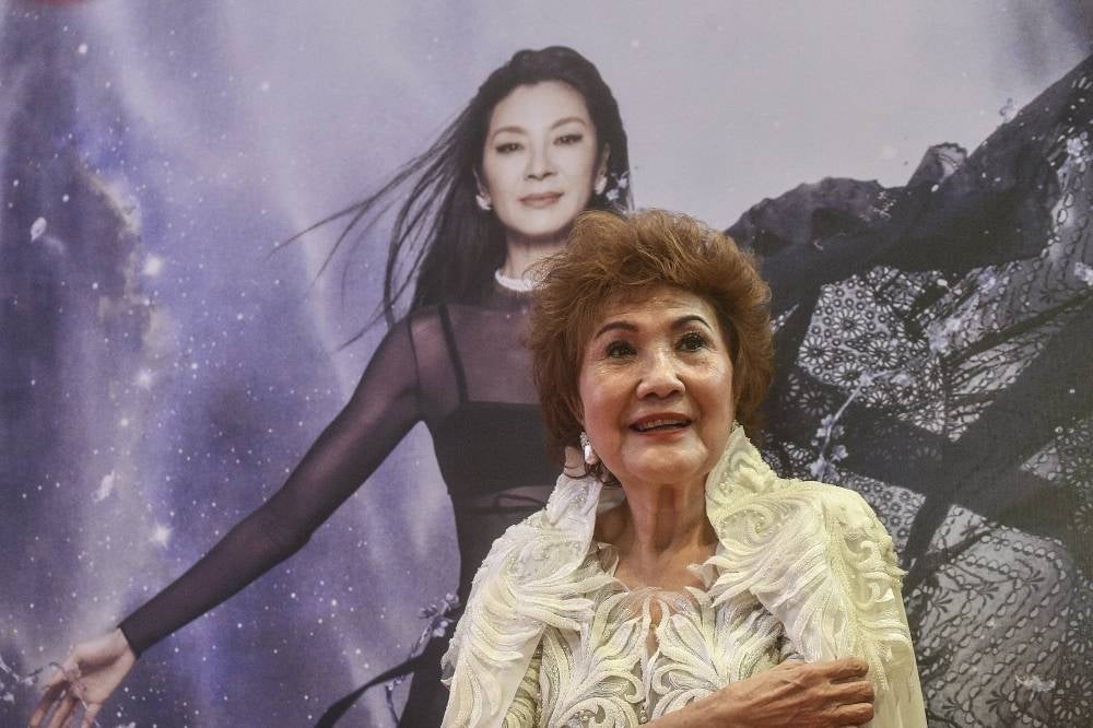 Janet Yeoh, mother of actress Michelle Yeoh, poses for photos after her daughter won the award for Best Actress in a Leading Role at the 95th Academy Awards in Los Angeles, at an event in Kuala Lumpur on March 13, 2023. (Photo by Arif Kartono / AFP)