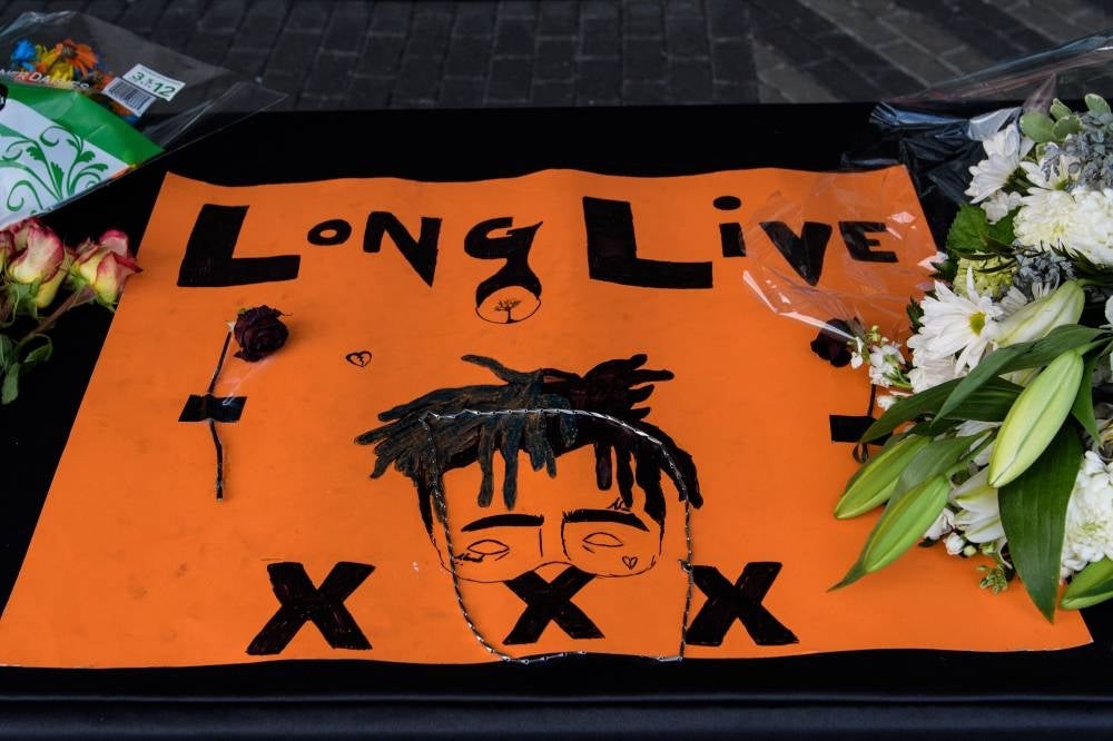 Fans leave items at a makeshift memorial outside the XXXTentacion Funeral & Fan Memorial at BB&T Center on June 27, 2018 in Sunrise, Florida. - (Photo by JASON KOERNER / AFP)