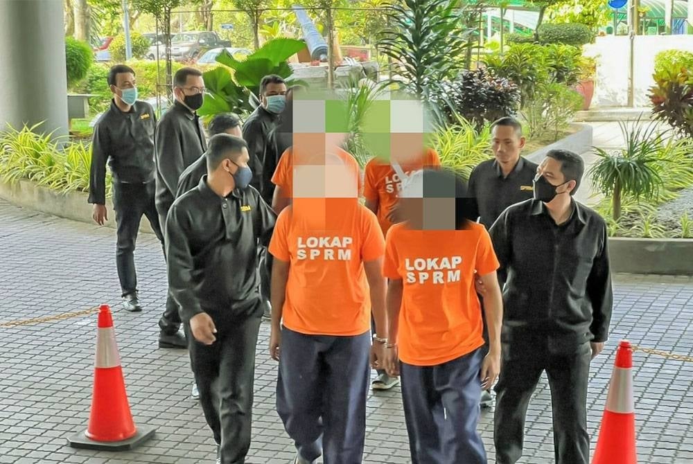 Among the individuals brought to the Shah Alam magistrate's court for a remand order to aid in the false claim investigations.