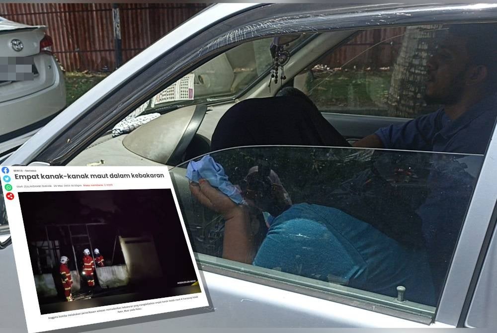 Nabila was seen crying and kissing a shirt belonging to one of her child who died in a house fire in Kampung Sabak Awor, Muar on Wednesday night.