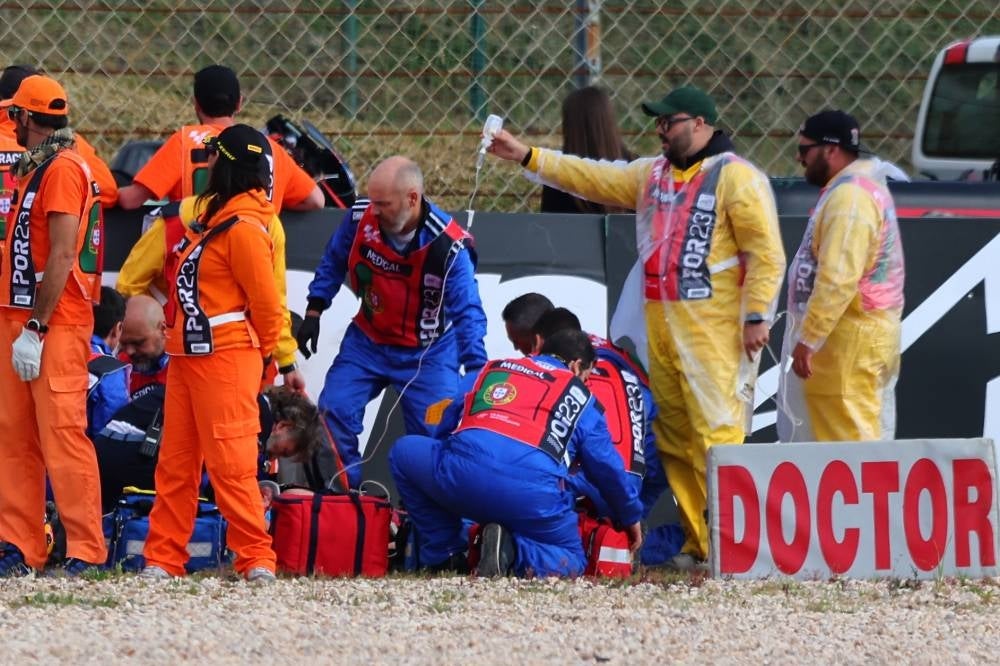 Spanish MotoGP rider Pol Espargaro of GasGas Factory Racing Tech3 is assisted by a medical team after a fall during the second practice session for the the Motorcycling Grand Prix of Portugal at Algarve International race track, in Portimao, south of Portugal, March 24.. Espargaro will be replaced by Germany's Jonas Folger for the Grand Prix of the Americas next month, the GasGas team announced today. - Pic: EPA