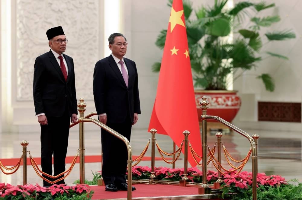 Prime Minister Datuk Seri Anwar Ibrahim (left) was accorded an official welcoming ceremony by the Chinese government in conjunction with his visit.He was greeted on arrival at the East Hall of the Great Hall of the People by his Chinese counterpart Li Qiang - BERNAMA -