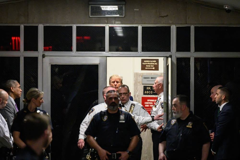 Former US president Donald Trump arrives at the courtroom at the Manhattan Criminal Court in New York on April 4, 2023 before his hearing. - (Photo by ED JONES / AFP)