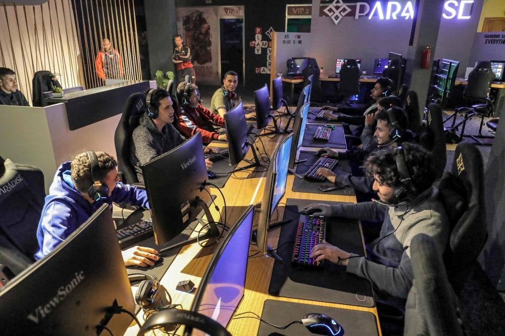 Youths play at a video gaming centre in Libya's capital Tripoli. - In an ultra-modern gaming space in Tripoli, players exchange banter amid the bleeping and music of video games. Isolated by decades of dictatorship and post-revolution chaos, Libyan gamers are finally ready to take on the world. - Pic: AFP