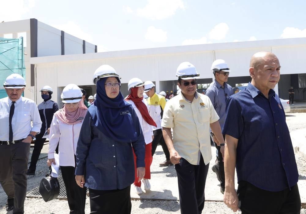 Health Minister Dr Zaliha Mustafa (three, left) visiting the Papar Hospital upgrading project site, today. - BERNAMA