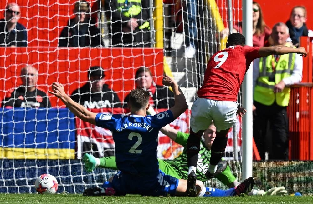 Manchester United's French striker Anthony Martial (R) scores the team's second goal past Everton's English goalkeeper Jordan Pickford during the English Premier League football match between Manchester United and Everton at Old Trafford in Manchester. - Pic: AFP
