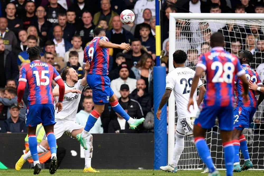 Crystal Palace's French-born Ghanaian striker Jordan Ayew (3L) heads home their second goal during the English Premier League football match between Leeds United and Crystal Palace at Elland Road in Leeds, northern England on April 9, 2023. (Photo by Oli SCARFF / AFP) / RESTRICTED TO EDITORIAL USE. No use with unauthorized audio, video, data, fixture lists, club/league logos or 'live' services. Online in-match use limited to 120 images. An additional 40 images may be used in extra time. No video emulation. Social media in-match use limited to 120 images. An additional 40 images may be used in extra time. No use in betting publications, games or single club/league/player publications. / 
