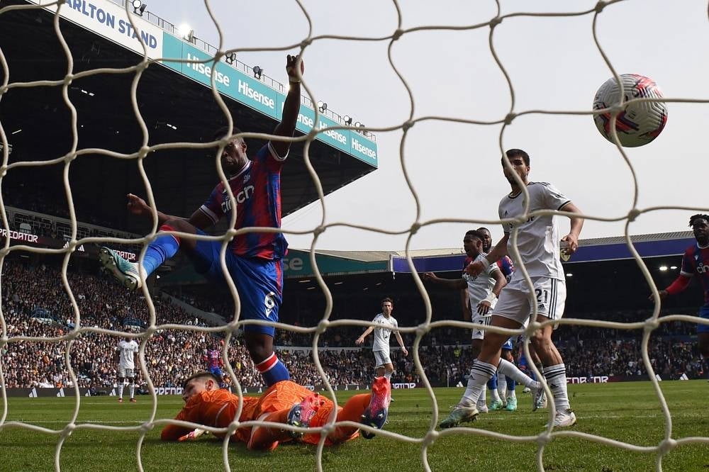 Crystal Palace's English defender Marc Guehi (L) scores past Leeds United's French goalkeeper Illan Meslier for their first goal during the English Premier League football match between Leeds United and Crystal Palace at Elland Road in Leeds, northern England on April 9. - Pic: AFP