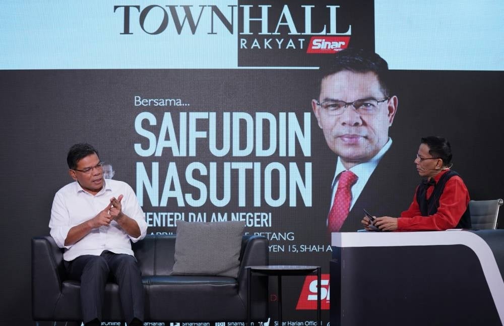 Home Minister Datuk Seri Saifuddin Nasution Ismail (left) during the Town Hall Programme at Karangkraf Complex on Monday. - Photo by Rosli Talib