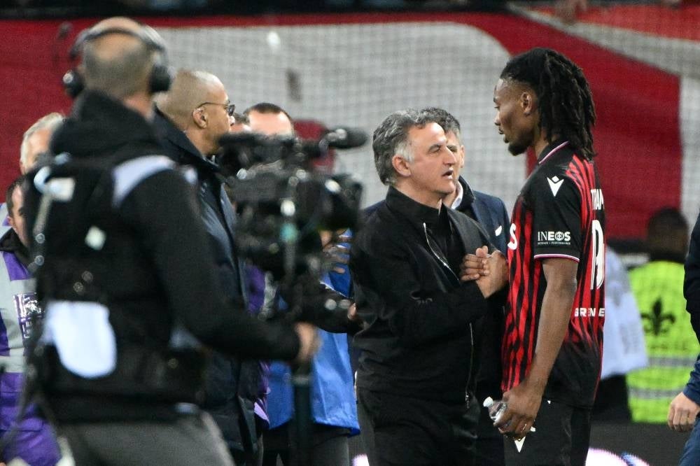 This photograph taken on April 8, shows Paris Saint-Germain's French head coach Christophe Galtier speaking with Nice's French midfielder Khephren Thuram at the end of the French L1 football match between Nice (OGCN) and Paris Saint-Germain (PSG) at the Allianz Riviera stadium in Nice. - Pic: AFP