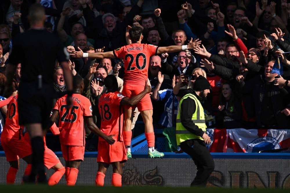 Brighton's Paraguayan striker Julio Enciso (C) celebrates with teammates in front of fans after scoring their second goal during the English Premier League football match between Chelsea and Brighton and Hove Albion at Stamford Bridge in London on April 15,. - Pic: AFP