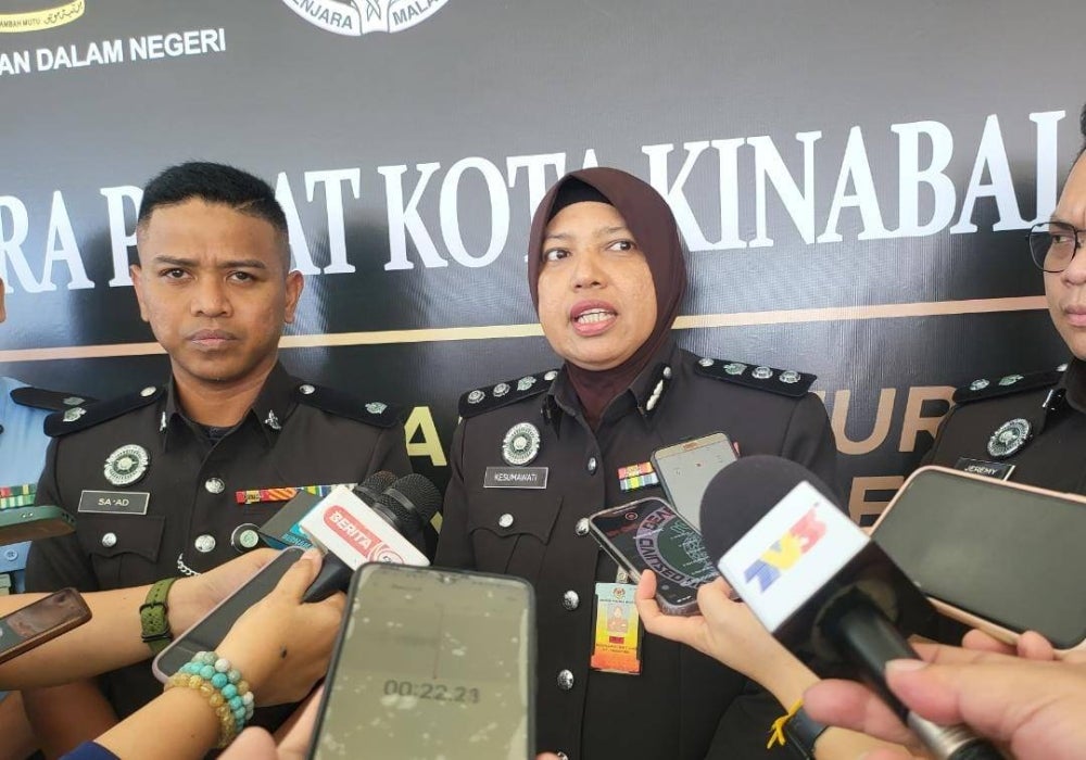 Kota Kinabalu Women's Prison director Kasumawati Ilas with Kota Kinabalu Central Prison deputy director Mohamad Sa'ad Bantalani when met by reporters at the Licensed Prisoner Release Programme at the Central Prison mini hall, today.