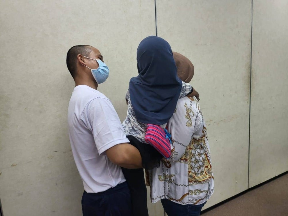 Hafiz sharing his happiness with his wife Lisa and their child after being given the opportunity to be released early from the Kota Kinabalu Central Prison.