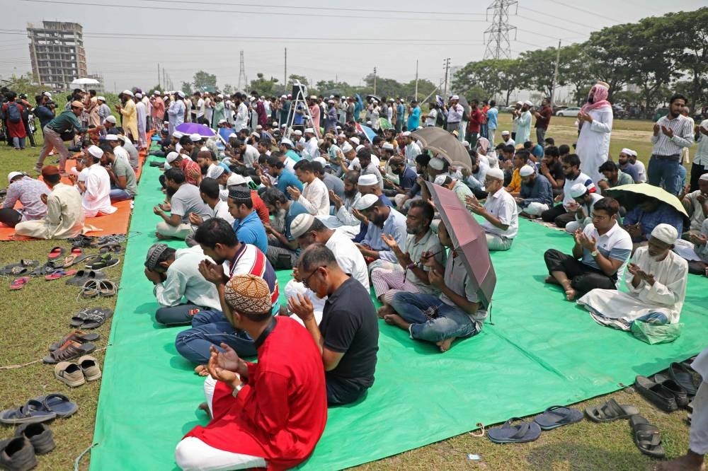 Muslims offer special prayers for rains at a field in Dhaka on April 17 - Hundreds of Muslims congregated at an open field in central Dhaka on April 17 to offer special prayers for rains as heatwave sweeps the country, soaring temperature to a record high in the capital, officials said. - Pic: AFP