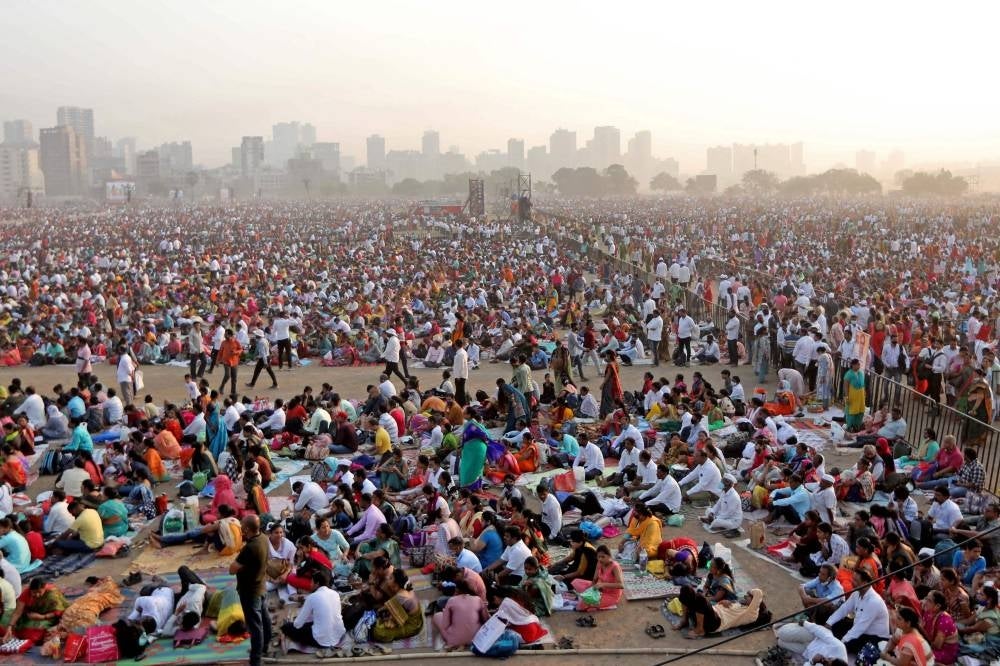 In this photograph taken on April 16,, people gather to attend an award ceremony on the outskirts of Mumbai. - Heatstroke killed 11 people in India after an estimated million spectators waited for hours in the sun at a government-sponsored awards ceremony, officials said as early summer temperatures soared. - Pic: AFP)