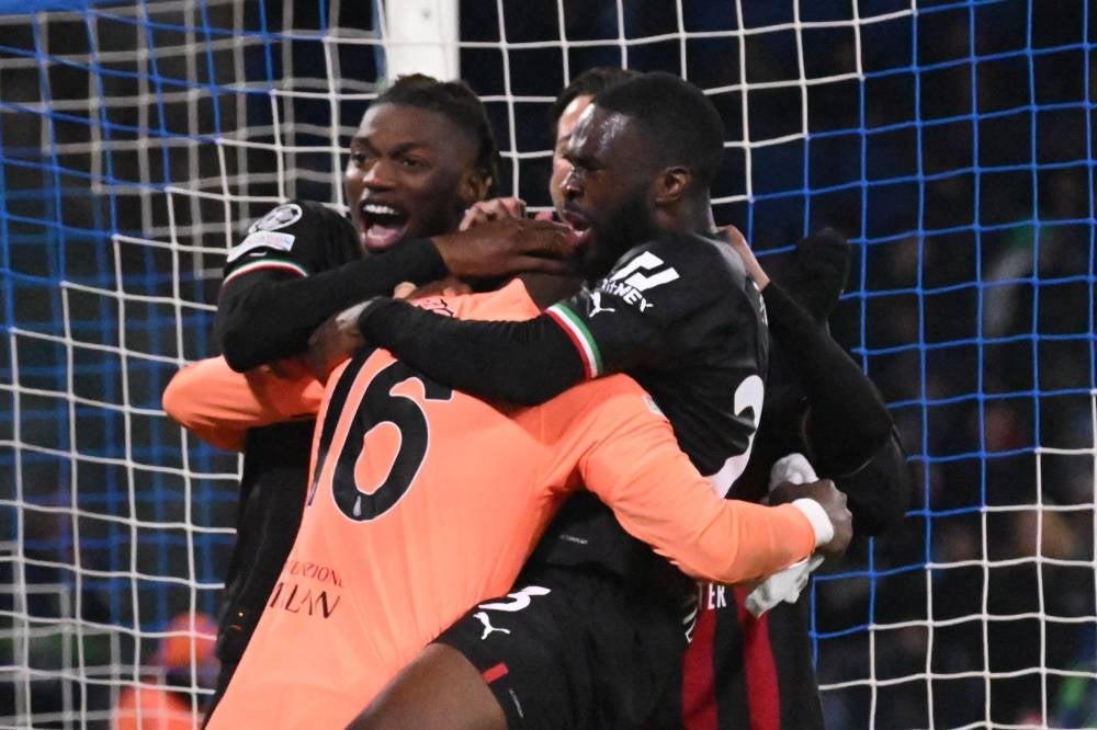 AC Milan players celebrate at the end of the UEFA Champions League quarter final second leg soccer match SSC Napoli vs AC Milan at the Diego Armando Maradona Stadium in Naples on April 18. - EPA