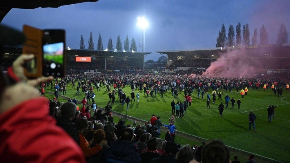 Wrexham have topped the National League to be promoted back into the English Football League.