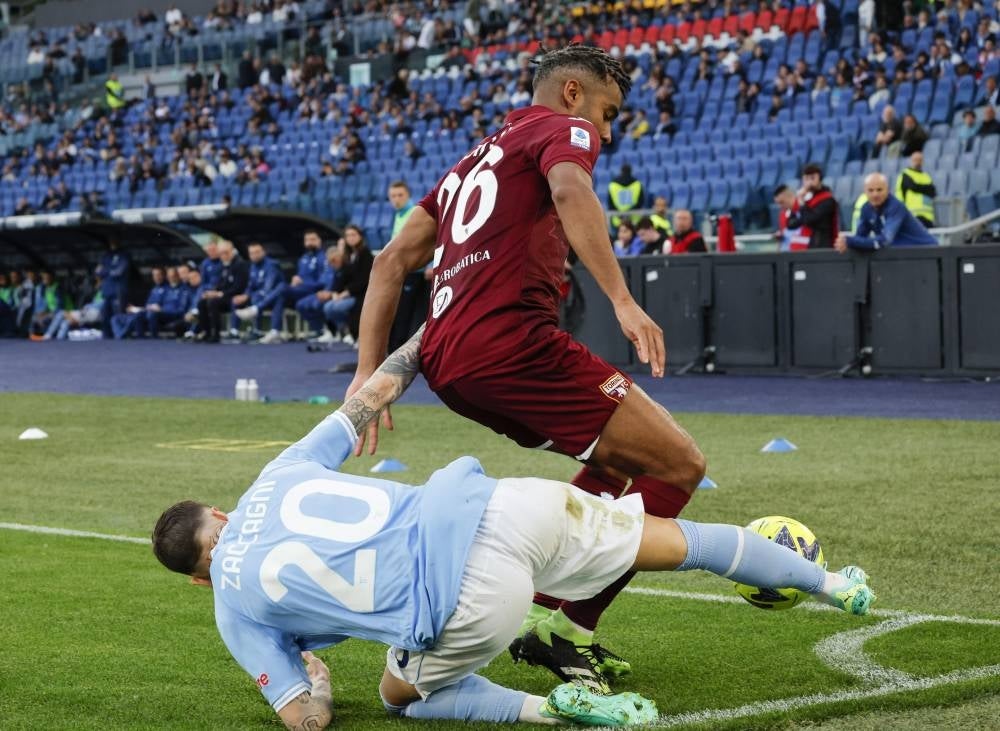  Lazio’s Mattia Zaccagni and Torino's Koffi Djidji in action during the Italian Serie A soccer match between SS Lazio vs Torino FC at the Olimpico stadium in Rome. April 22.- Pic: EPA