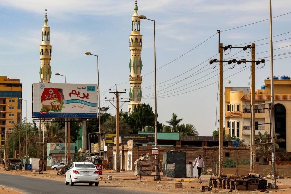 A vehicle drives along an empty street in Khartoum on April 18, 2023 in the aftermath of fighting between the Sudanese army and paramilitary forces led by rival generals. - AFP pic