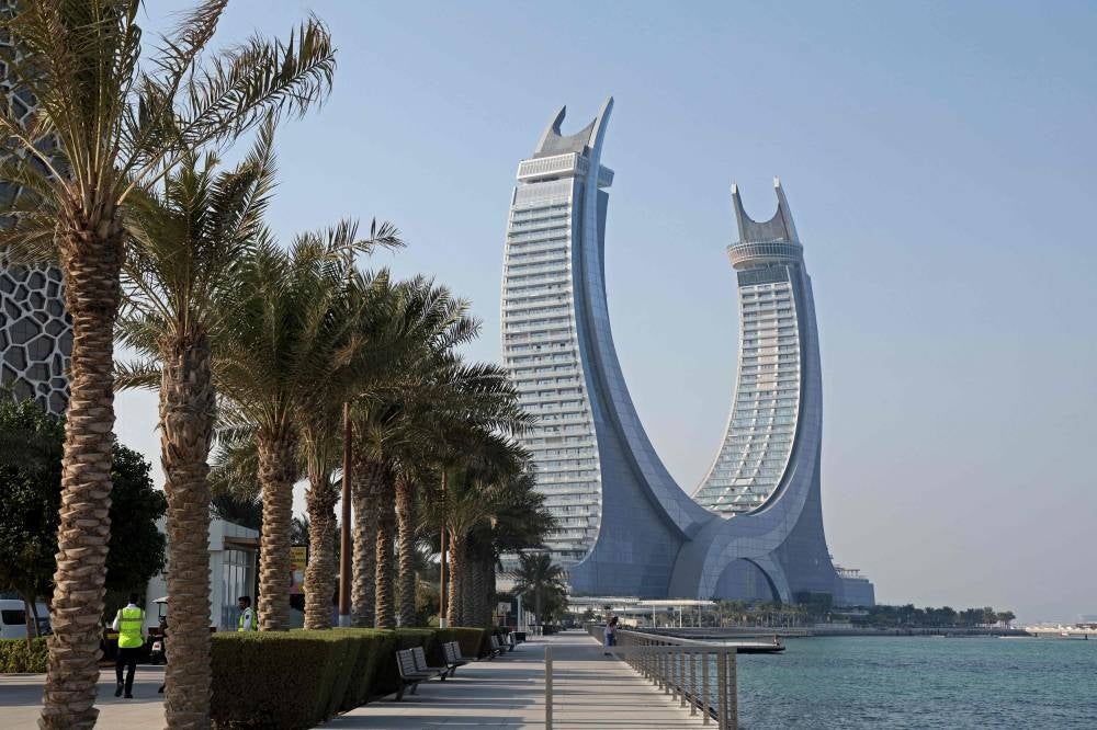 In this file photo taken on October 1, 2022 a general view shows the Katara Towers in the Qatari coastal city of Lusail ahead of the Qatar 2022 FIFA World Cup. - Months after hundreds of thousands of football fans packed into its hotels and stadiums, Qatar is seeking to remedy a bout of the post-World Cup blues by hosting more international events. Along with the departed football crowds, thousands of foreign workers left the Gulf state after Lionel Messi lifted the coveted trophy on December 18. Many of those who stayed on are counting the cost. - Pic: AFP