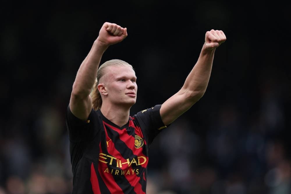 Manchester City's Norwegian striker Erling Haaland celebrates on the pitch after the English Premier League football match between Fulham and Manchester City at Craven Cottage in London on April 30.. - Man City won the game 2-1. - Pic: AFP