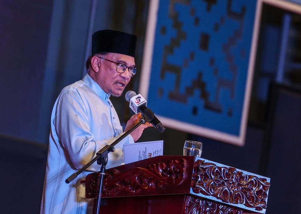 Prime Minister Datuk Seri Anwar Ibrahim delivering his speech at the Malaysia Madani open house at Penang UiTM, today. - BERNAMA