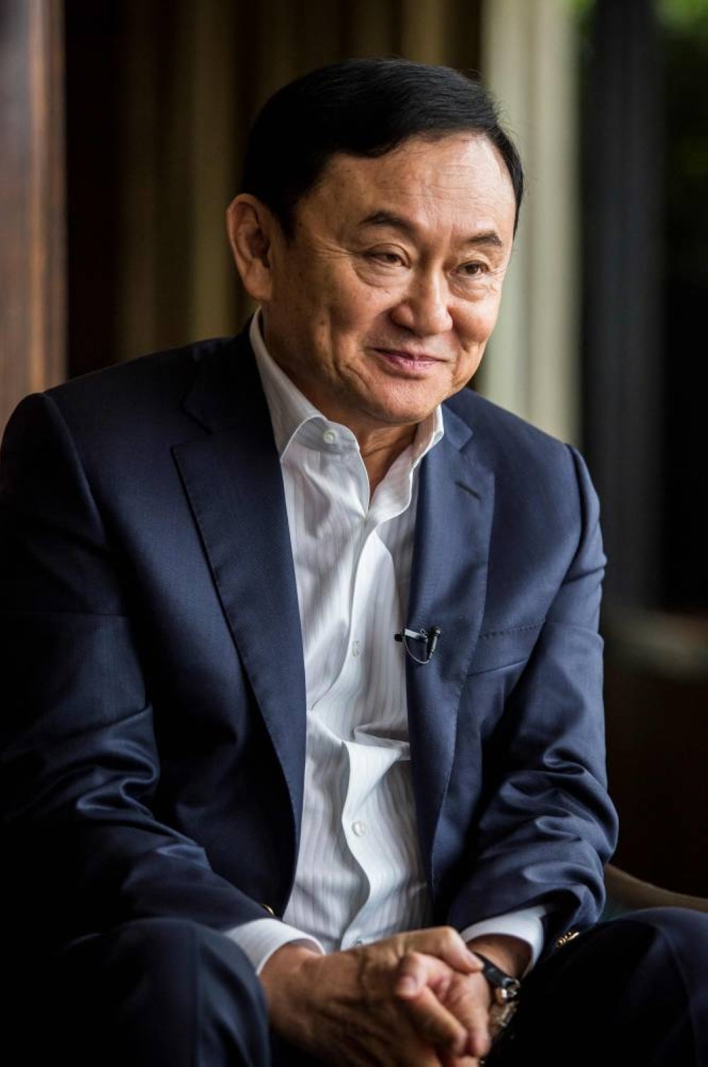 (FILES) This file photo taken on March 25, 2019 shows exiled former Thai prime minister Thaksin Shinawatra during an interview with AFP in Hong Kong. - Photo by ISAAC LAWRENCE / AFP
