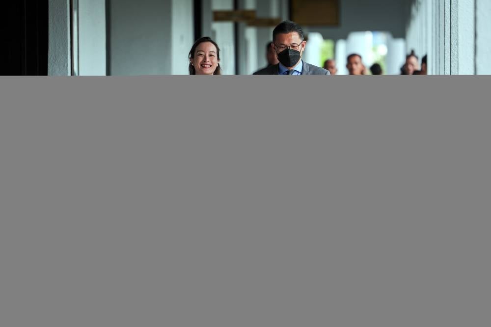 Company director Datuk Seri Sim Choo Thiam (right) pleaded not guilty to charges of soliciting and accepting bribes amounting to RM15 million to secure projects from the Home Ministry in 2021. - BERNAMA