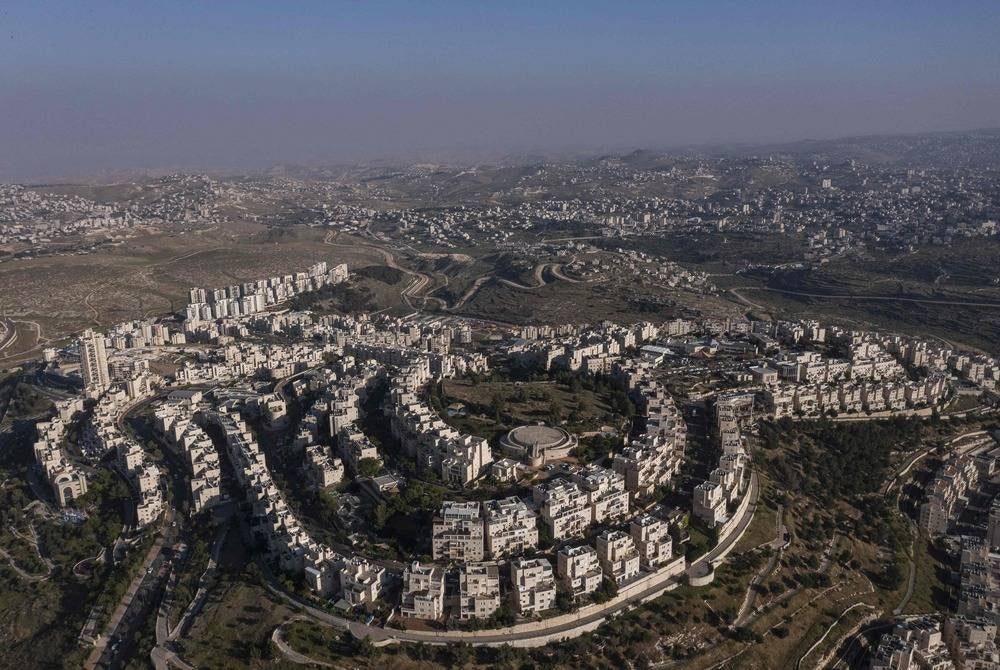 This aerial view taken on May 2, 2023 shows the Israeli settlement of Har Homa on Jebel Abu Ghneim hill, in the southern part of east Jerusalem. Israel has occupied the West Bank, home to around 2.9 million Palestinians, since the 1967 Six-Day War. Around 475,000 Jewish settlers also live there in state-approved settlements considered illegal under international law. (Photo by MENAHEM KAHANA / AFP)