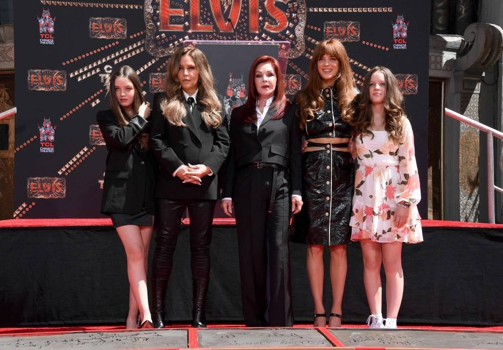 (L-R) Harper Vivienne Ann Lockwood, Lisa Marie Presley, Priscilla Presley, Riley Keough, and Finley Aaron Love Lockwood attend the Handprint Ceremony honoring Priscilla Presley, Lisa Marie Presley And Riley Keough at TCL Chinese Theatre on June 21, 2022 in Hollywood, California. Elvis Presley's widow Priscilla Presley has reached a settlement over their late daughter's fortune, following a dispute over an amendment removing her from the will. (Photo by Jon Kopaloff / GETTY IMAGES NORTH AMERICA / AFP)
